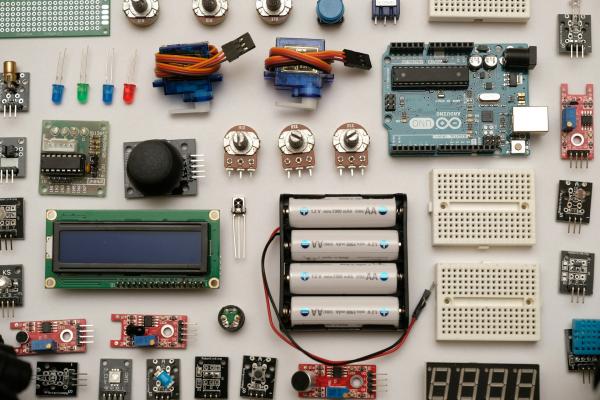 Picture of different pieces of electronic components laid out of a table seen from above